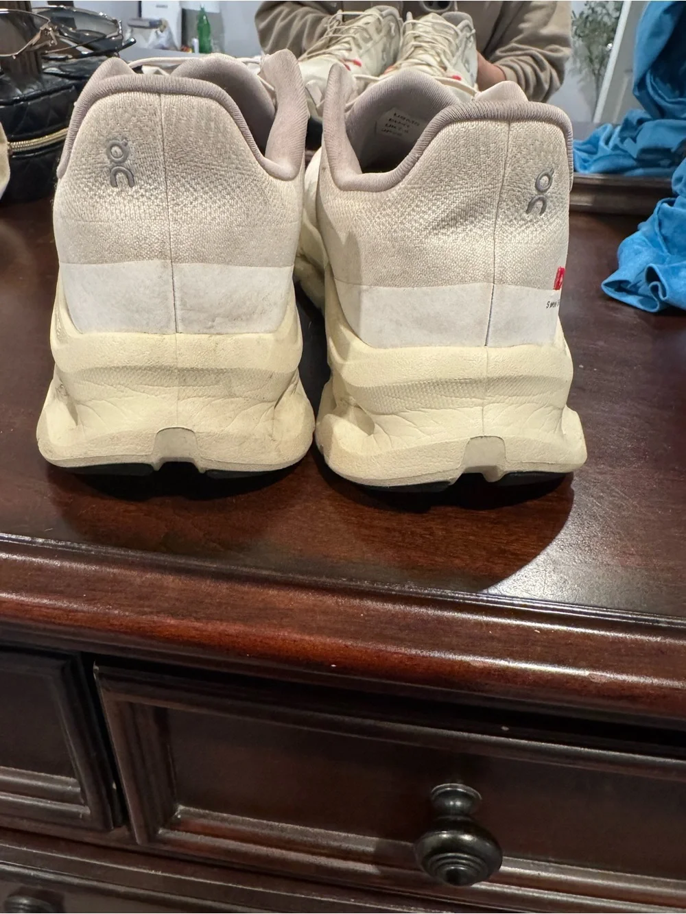 On Running Men’s Athletic Shoes in Cream with Red Accents